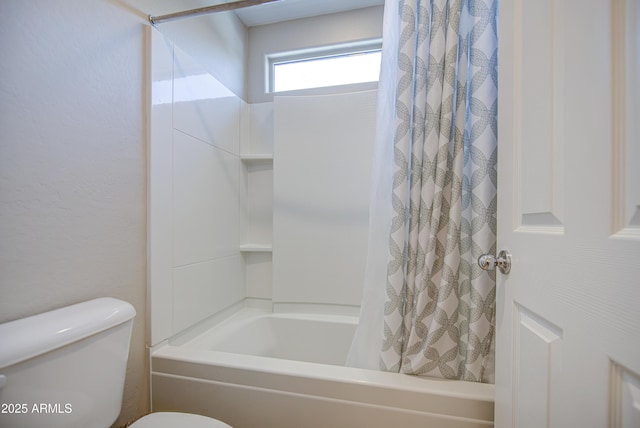 bathroom with shower / bath combination with curtain and toilet