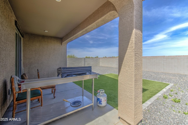 view of patio with a fenced backyard