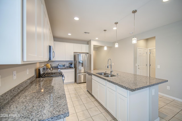 kitchen with white cabinetry, light tile patterned flooring, visible vents, appliances with stainless steel finishes, and a sink