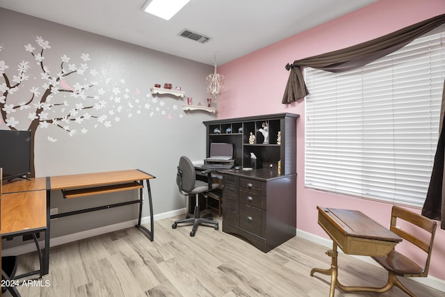 office area with light hardwood / wood-style floors