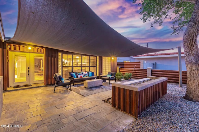 patio terrace at dusk with an outdoor living space