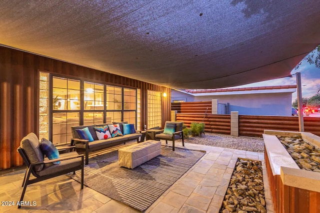 patio terrace at dusk with an outdoor hangout area