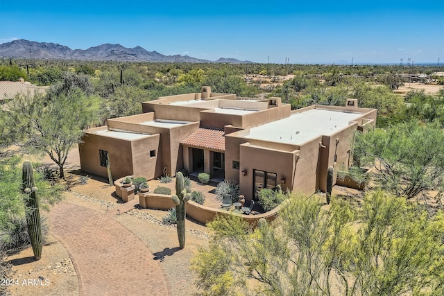 birds eye view of property with a mountain view