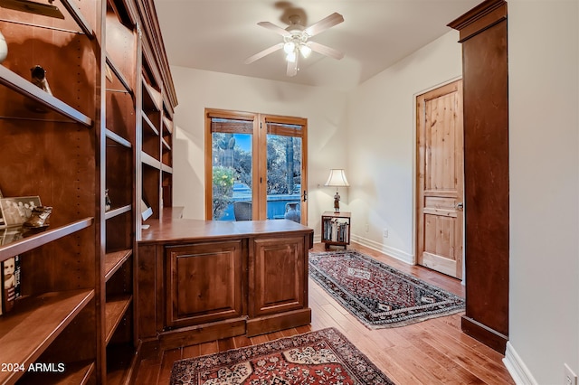 office featuring ceiling fan and light hardwood / wood-style flooring