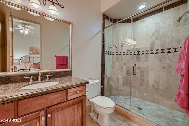 bathroom with ceiling fan, toilet, an enclosed shower, tile patterned floors, and vanity