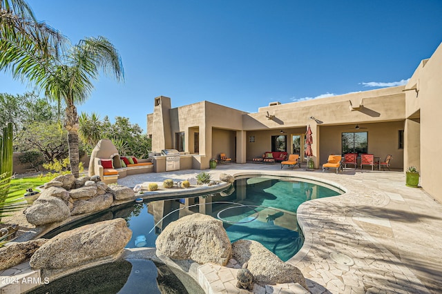 view of pool featuring a patio area and ceiling fan