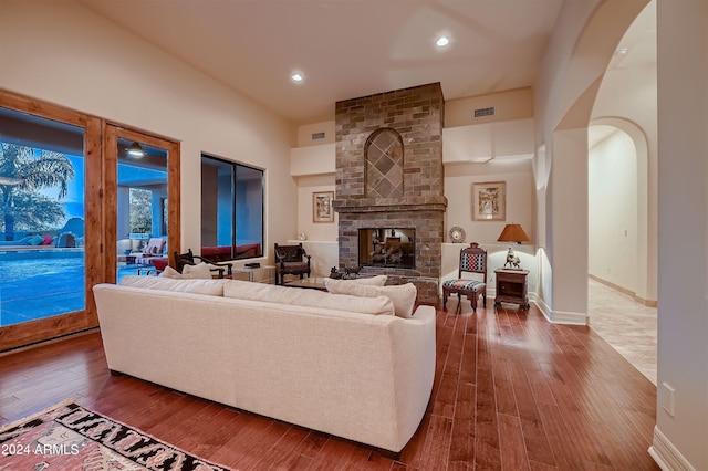 living room featuring a fireplace and wood-type flooring