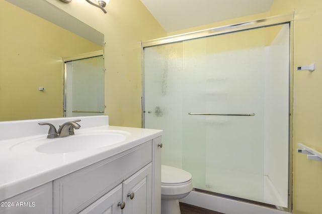 bathroom featuring walk in shower, vanity, and toilet