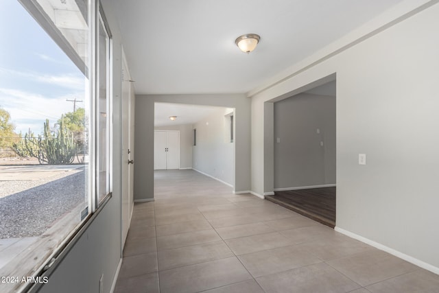 hallway featuring light tile patterned flooring