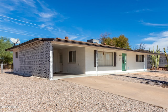 rear view of house featuring a carport