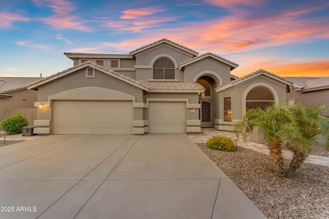 9702 E Naranja Ave, Mesa, AZ 85209 - mediterranean / spanish-style house featuring stucco siding, driveway, and a tiled roof