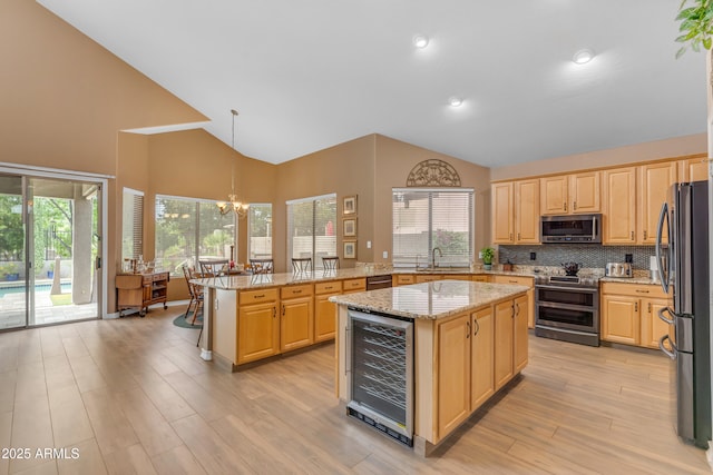 9702 E Naranja Ave, Mesa, AZ 85209 - kitchen featuring stainless steel appliances, beverage cooler, a sink, high vaulted ceiling, and light brown cabinets