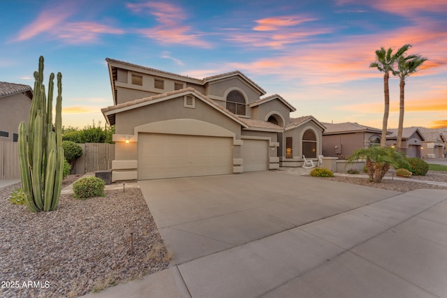 9702 E Naranja Ave, Mesa, AZ 85209 - mediterranean / spanish-style house featuring stucco siding, a garage, concrete driveway, and a tile roof