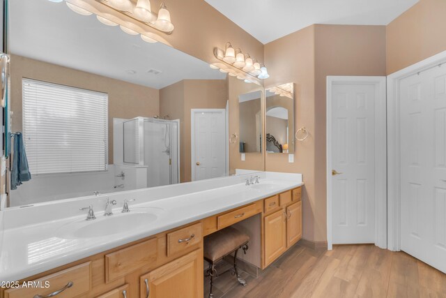 9702 E Naranja Ave, Mesa, AZ 85209 - bathroom with a shower stall, double vanity, and wood finished floors