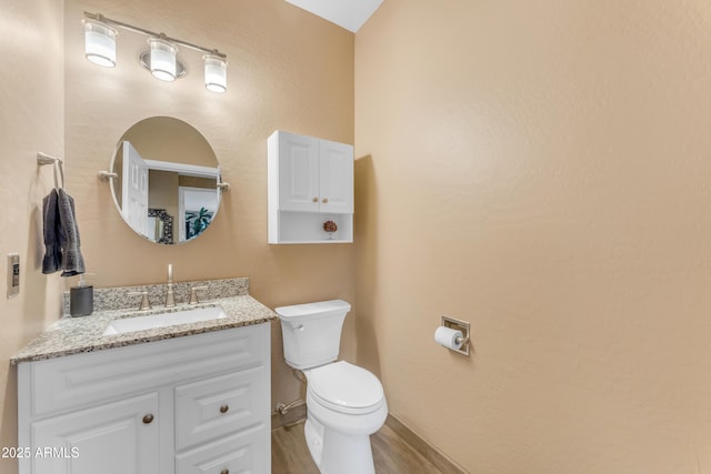9702 E Naranja Ave, Mesa, AZ 85209 - half bath with vanity, toilet, and wood finished floors