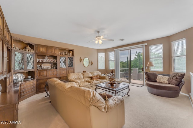 9702 E Naranja Ave, Mesa, AZ 85209 - living room with light carpet and a ceiling fan