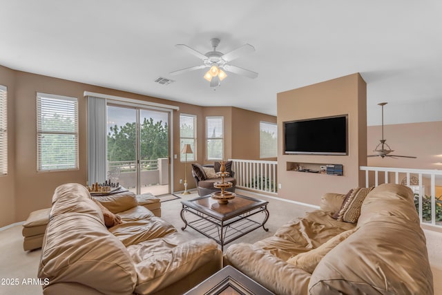 9702 E Naranja Ave, Mesa, AZ 85209 - living area with a ceiling fan, light colored carpet, and baseboards