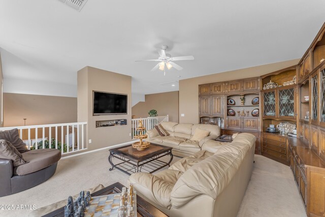 9702 E Naranja Ave, Mesa, AZ 85209 - living area featuring light carpet, ceiling fan, and baseboards