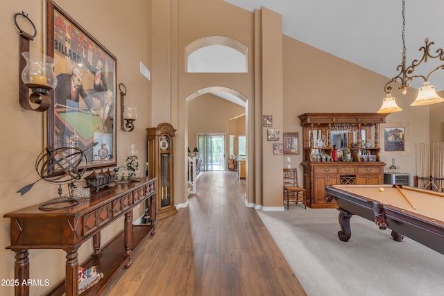 9702 E Naranja Ave, Mesa, AZ 85209 - playroom featuring arched walkways, high vaulted ceiling, wood finished floors, baseboards, and pool table