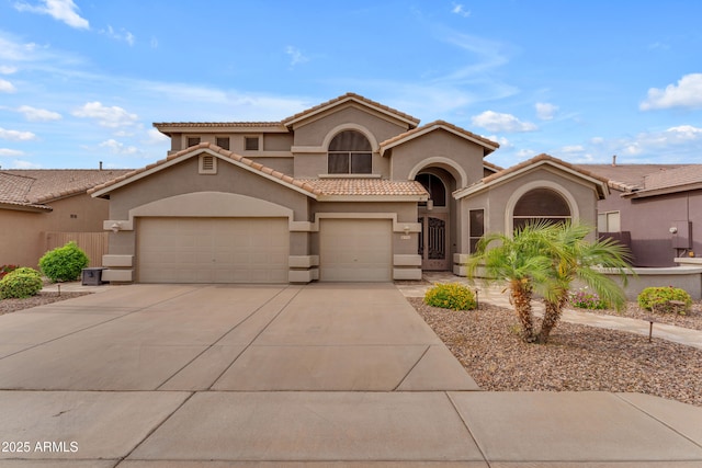 9702 E Naranja Ave, Mesa, AZ 85209 - mediterranean / spanish-style home featuring stucco siding, concrete driveway, a tile roof, and a garage