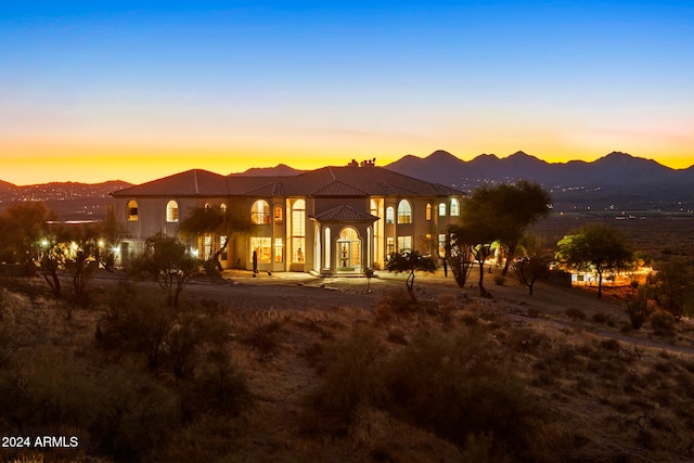 view of front of property with a mountain view