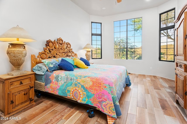 bedroom with light hardwood / wood-style floors