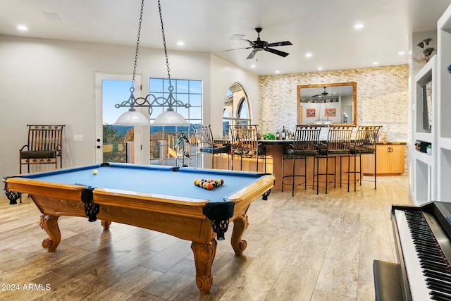 rec room featuring bar, ceiling fan, light hardwood / wood-style flooring, and pool table