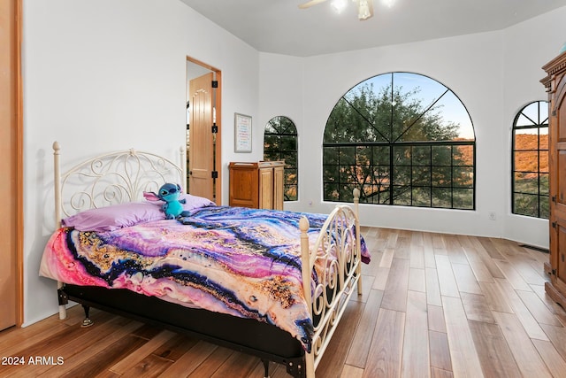 bedroom featuring wood-type flooring and ceiling fan