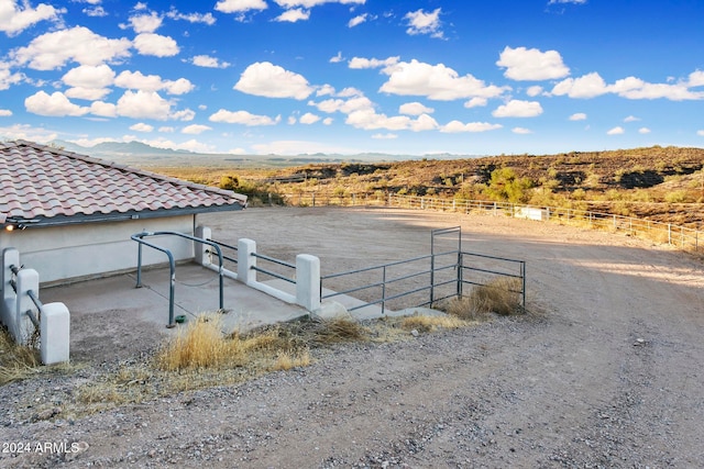 view of yard featuring a mountain view and a rural view