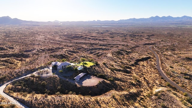 birds eye view of property featuring a mountain view