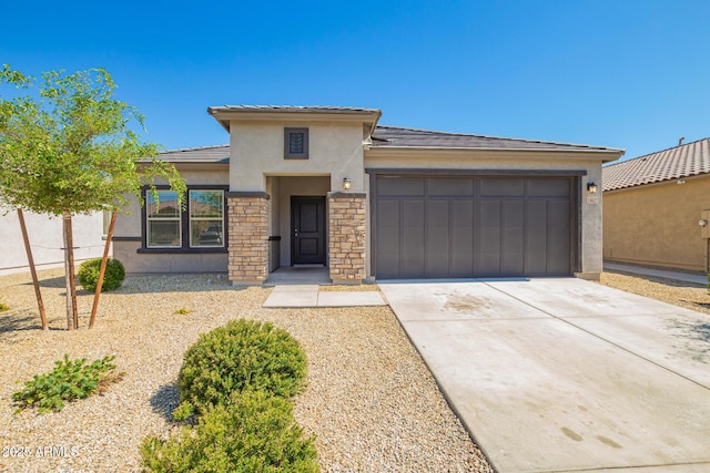 24627 W Ripple Rd, Buckeye, AZ 85326 - prairie-style house featuring stucco siding, a garage, driveway, and stone siding