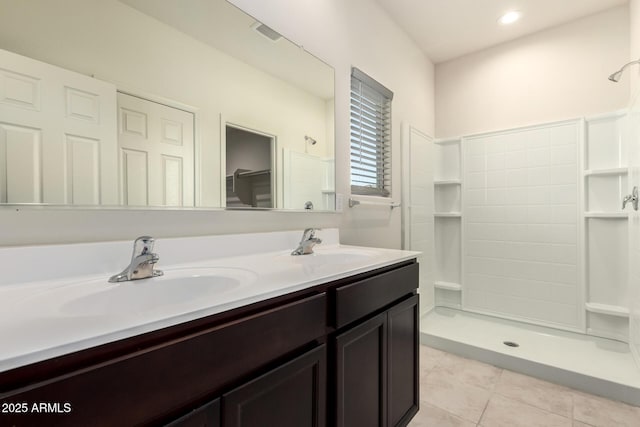 24627 W Ripple Rd, Buckeye, AZ 85326 - full bathroom with tile patterned flooring, a shower, and double vanity