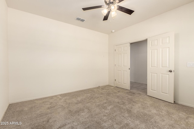 24627 W Ripple Rd, Buckeye, AZ 85326 - unfurnished bedroom with light carpet and ceiling fan