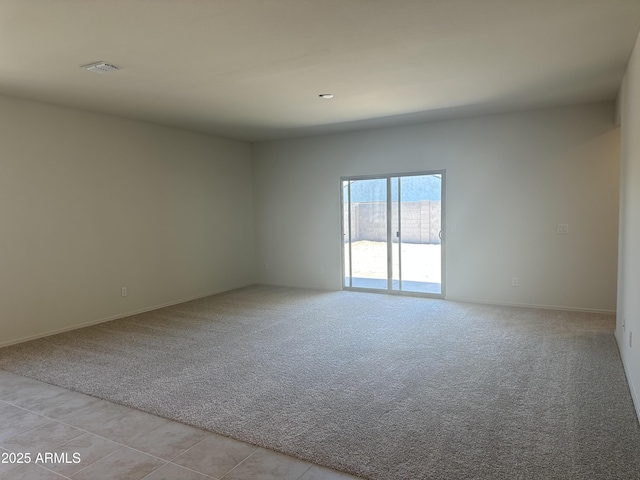 24627 W Ripple Rd, Buckeye, AZ 85326 - unfurnished room with light colored carpet and light tile patterned flooring
