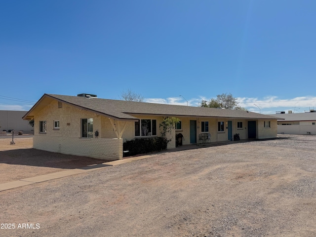 ranch-style house with brick siding