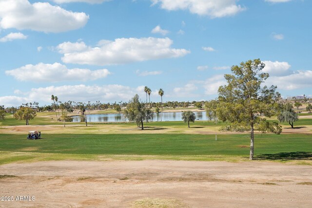 view of home's community featuring a water view and a yard