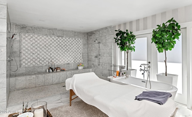 bathroom featuring a tile shower