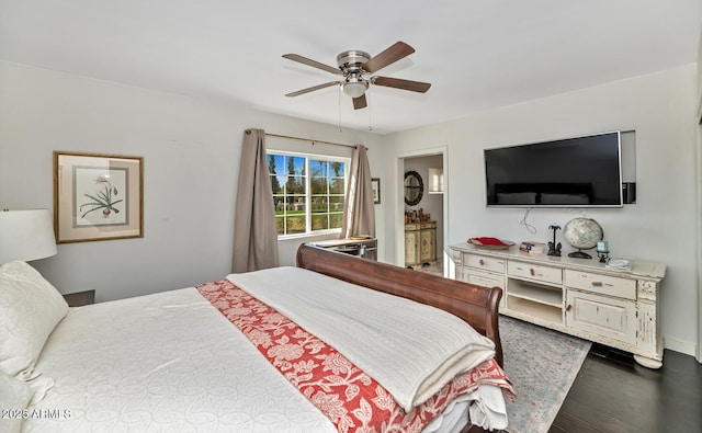 bedroom with dark wood-style floors and ceiling fan