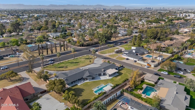 birds eye view of property with a residential view