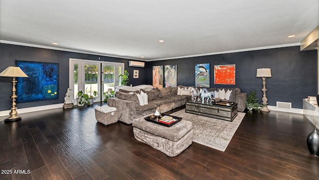 living area with baseboards, crown molding, visible vents, and wood finished floors