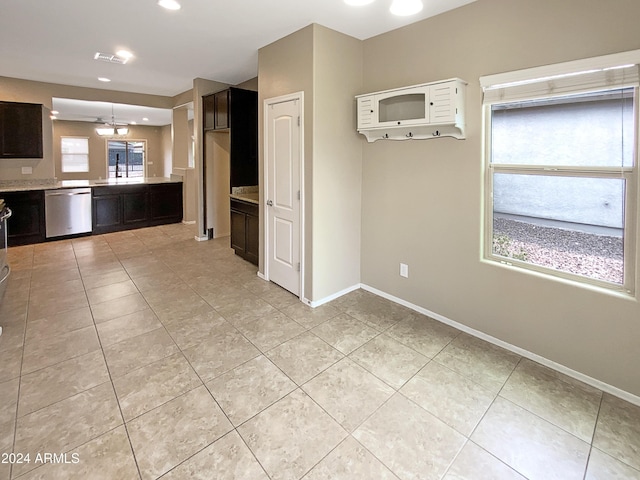 kitchen featuring dishwasher, light countertops, a wealth of natural light, and visible vents