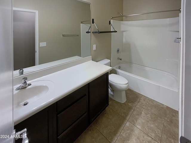 bathroom featuring toilet, shower / tub combination, vanity, and tile patterned floors