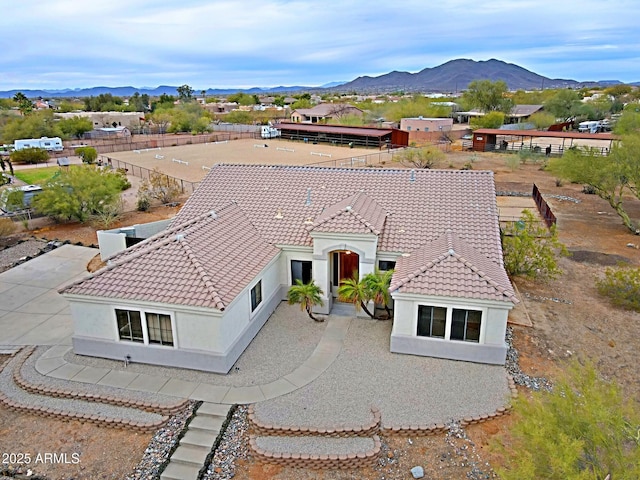 birds eye view of property with a mountain view