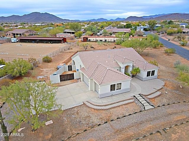 birds eye view of property featuring a mountain view