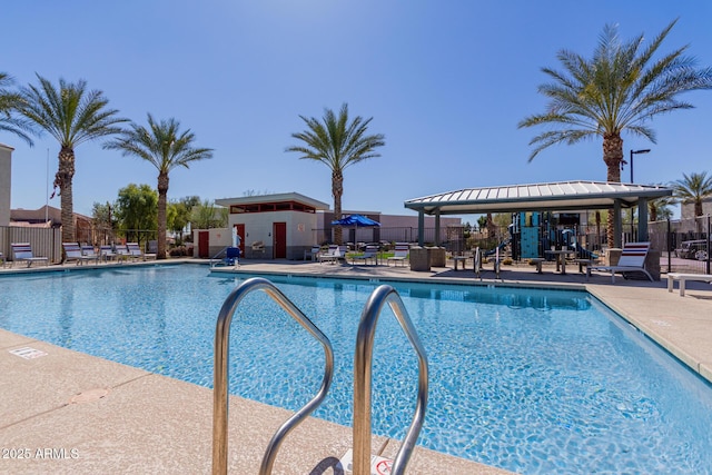 pool with a patio, a gazebo, and fence