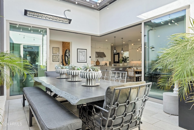 dining space featuring light tile patterned floors