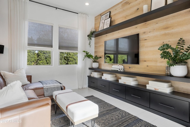 living room featuring wood walls