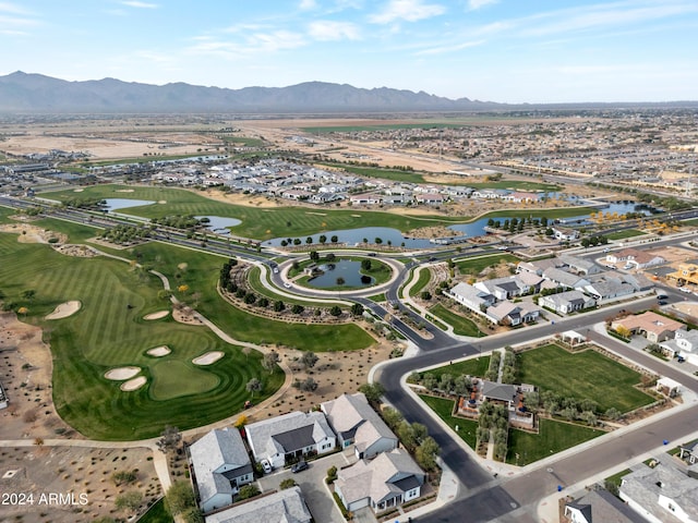 birds eye view of property with a water and mountain view