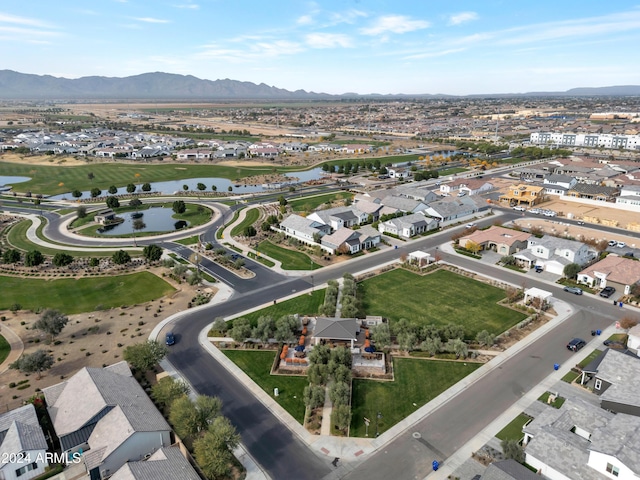 bird's eye view with a water and mountain view