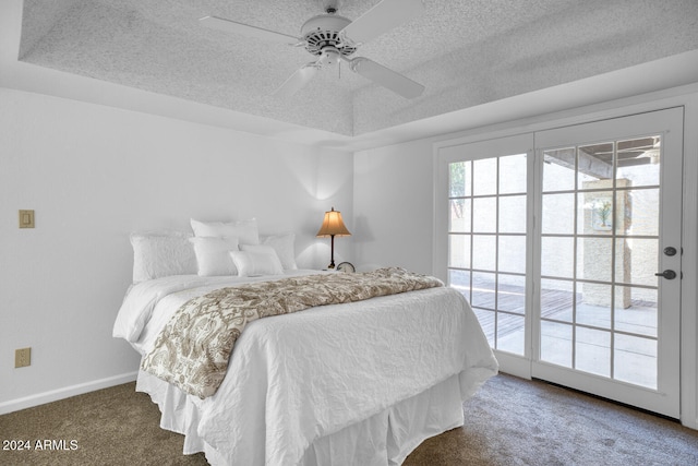 bedroom featuring multiple windows, ceiling fan, and dark carpet